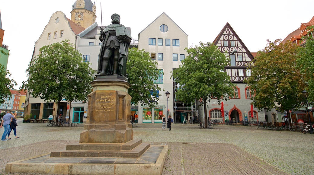 Jena which includes a square or plaza and a statue or sculpture