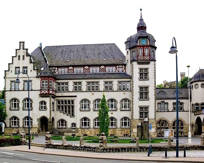 A historic building with a prominent tower and a clock.