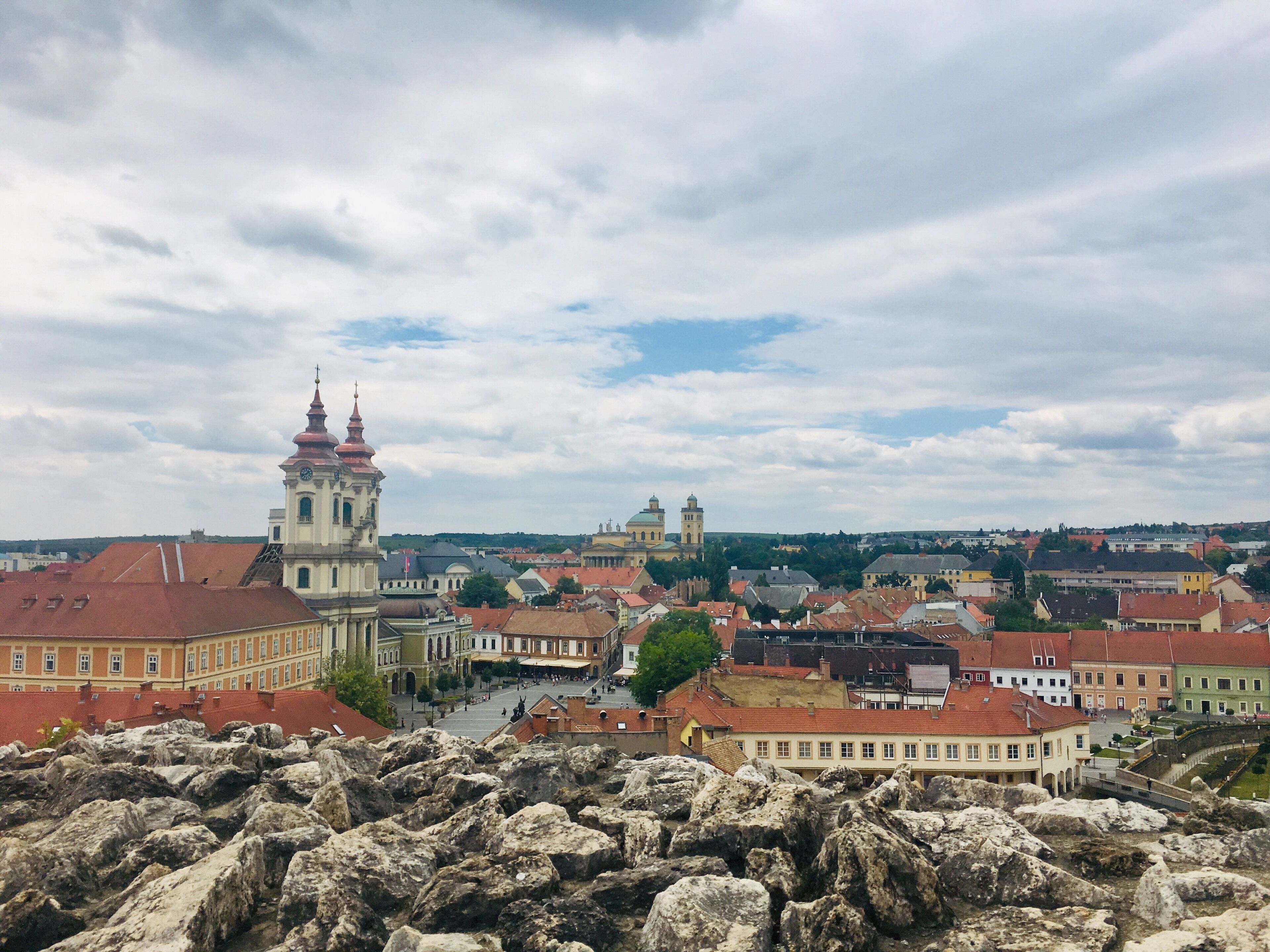 A historic town with prominent churches and a river.