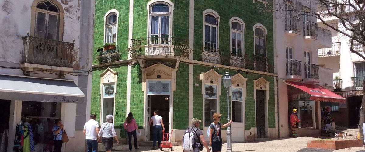 A fantastic house covered in green ceramic tiles in Lagos, Portugal.  The colour of the green is amazing on a hot sunny day here.
