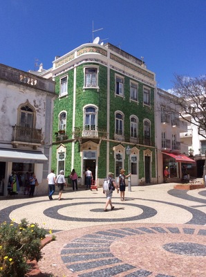 A fantastic house covered in green ceramic tiles in Lagos, Portugal.  The colour of the green is amazing on a hot sunny day here.