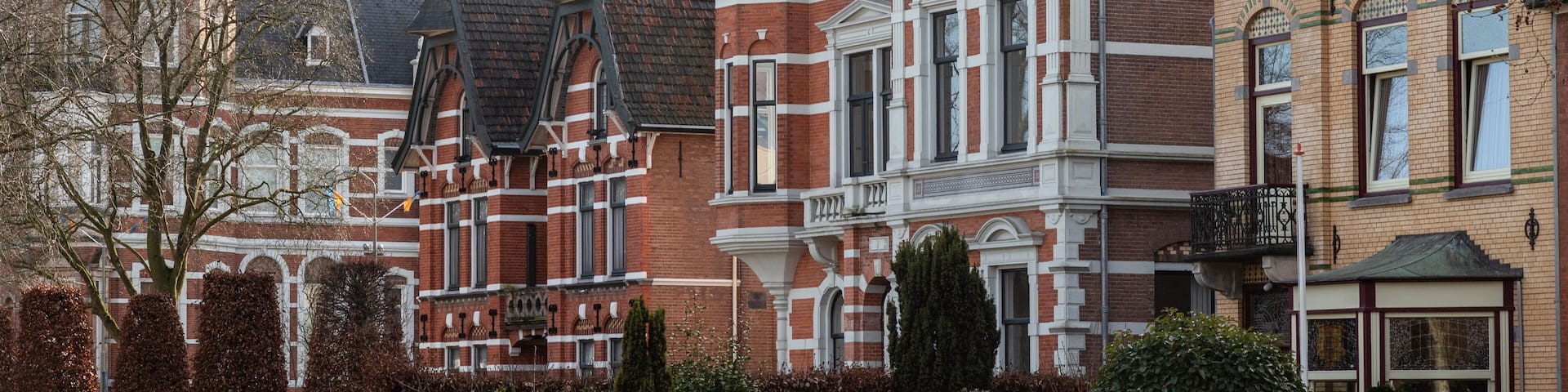 Historic buildings with different facades in the center of the Dutch town of Oss.