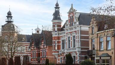 Historic buildings with different facades in the center of the Dutch town of Oss.