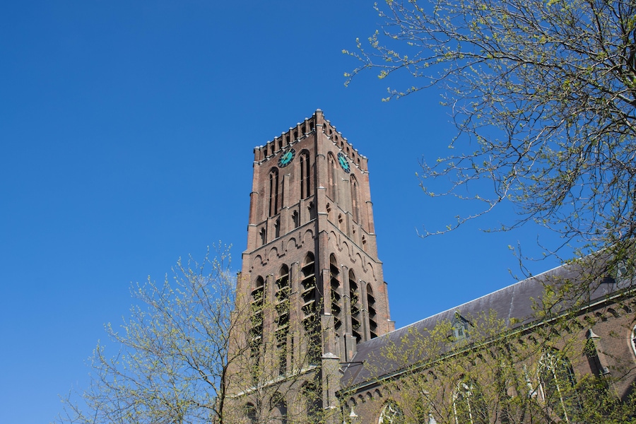 The neogothic Big Church in Oss, the Netherlands seen from Monsterstraat. The architect of this monument was H.J. van Tulder and the tower is 54 metres.