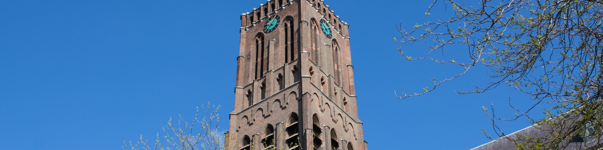 The neogothic Big Church in Oss, the Netherlands seen from Monsterstraat. The architect of this monument was H.J. van Tulder and the tower is 54 metres.
