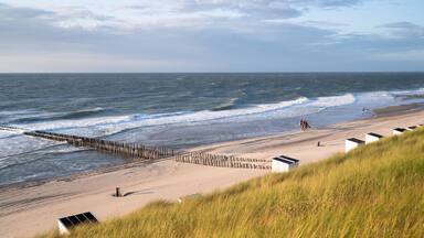 Sea dunes with ocean view at sunset