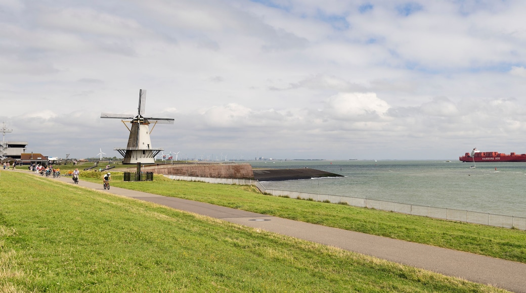 Dutch traditional windmill Oranjemolen at dike near Vlissingen the only windmill in the Netherlands that is located directly near the sea. province Zeeland