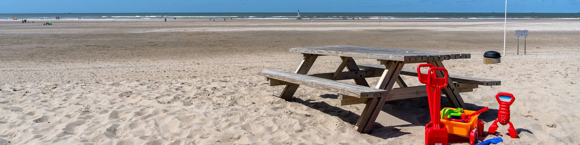 Kijkduin Beach on a sunny day in June with beach toys #2