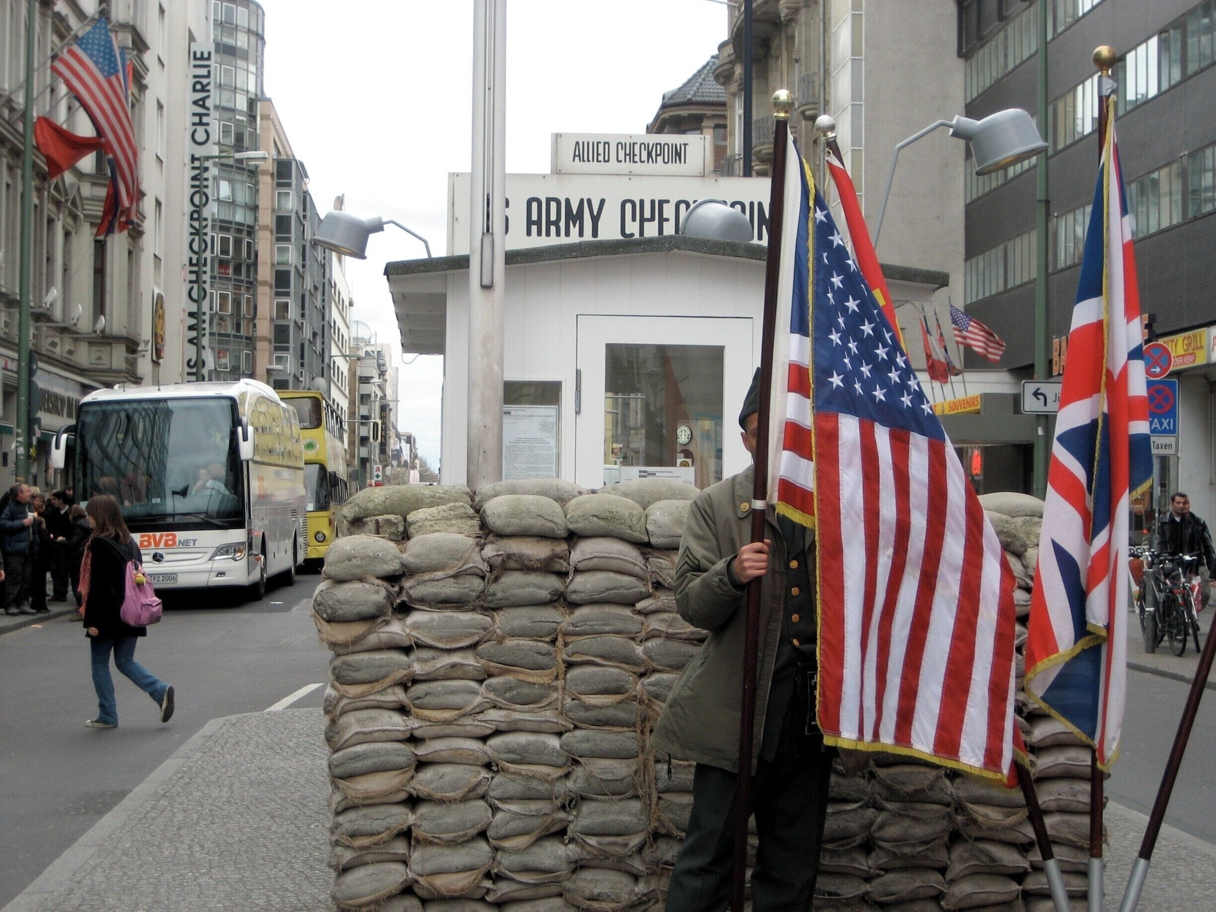 Berlin is well worth a visit and stay at least five days. The wall is sombre yet fascinating. I chose to put in the photo of Checkpoint Charlie, but don't skip the sad history. #walls