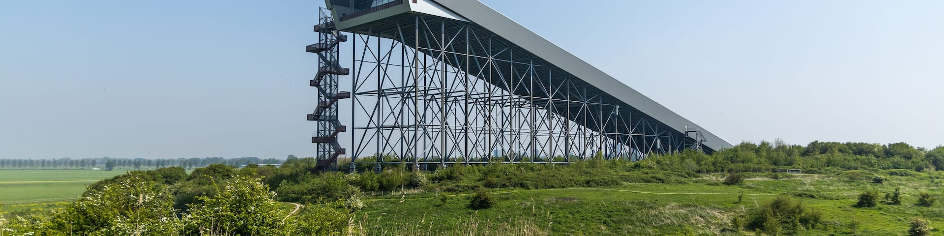Indoor skislope of Snowworld in a green and sunny area. Zoetermeer, the Netherlands. 1 May 2024.