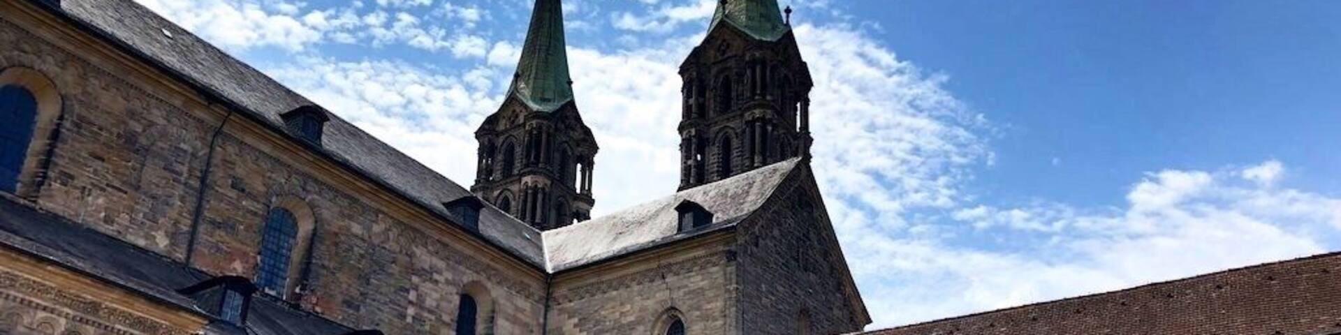 The Bamberg Cathedral is a church in Bamberg, Germany, completed in the 13th century. The cathedral is under the administration of the Roman Catholic Church and is the seat of the Archbishop of Bamberg. Since 1993, the cathedral has been part of the UNESCO World Heritage Site "Town of Bamberg".
It was founded in 1002 by King (and later Emperor) Heinrich II (Henry II) and consecrated in 1012. After the first two cathedrals burned down in the 11th and 12th centuries, the current structure, a late Romanesque building with four large towers, was built in the 13th century.