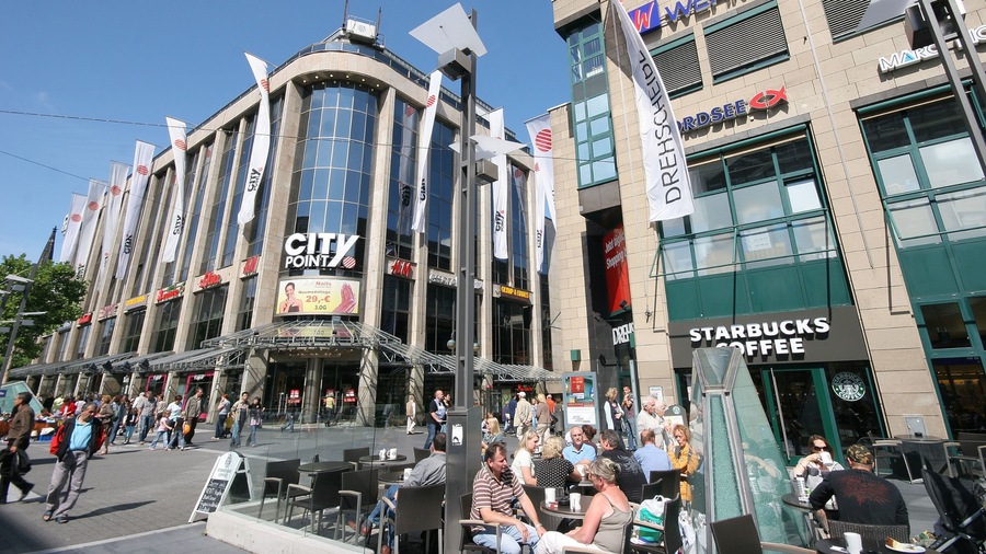 Bochum showing a city, modern architecture and outdoor eating
