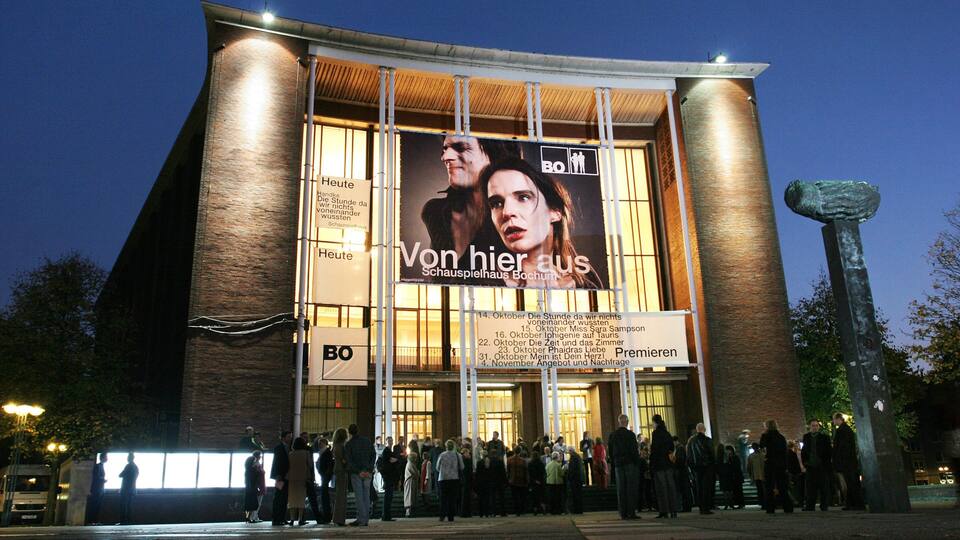 Bochum featuring signage, night scenes and modern architecture