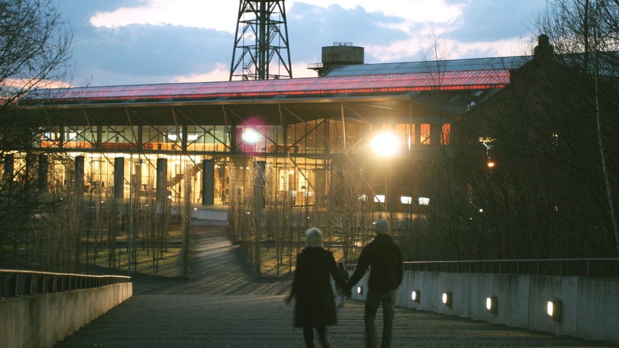 Bochum featuring a sunset and modern architecture as well as a couple