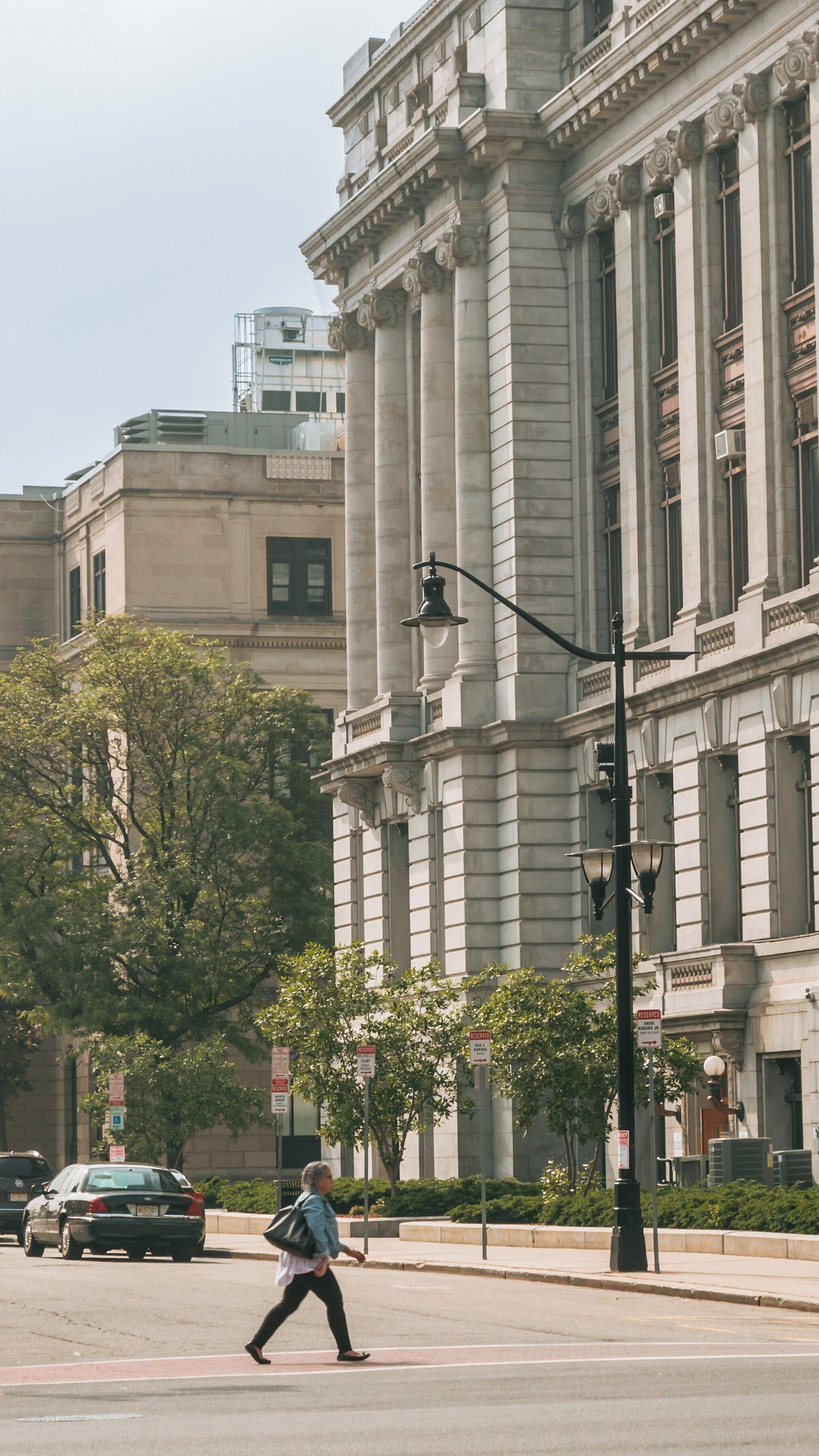Historic Newark City Hall showcases stunning architecture in the bustling Newark Central Business District of New Jersey during a sunny afternoon