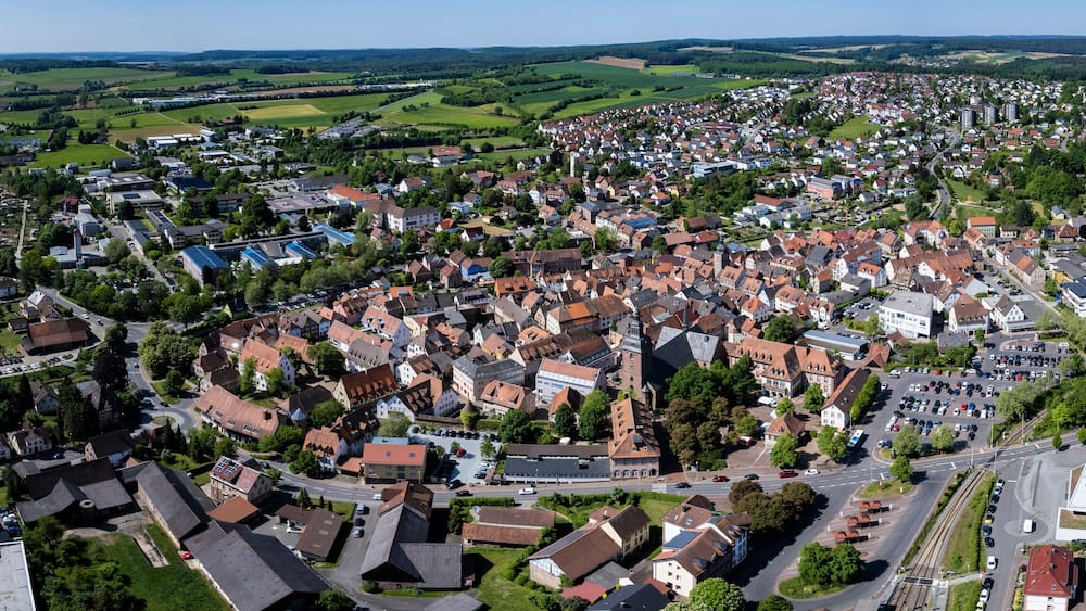 Aerial panoramic view of the old town city Buchen in Germany on a sunny spring noon.