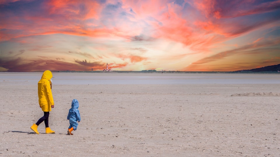 A vast, flat landscape with a striking sunset sky.