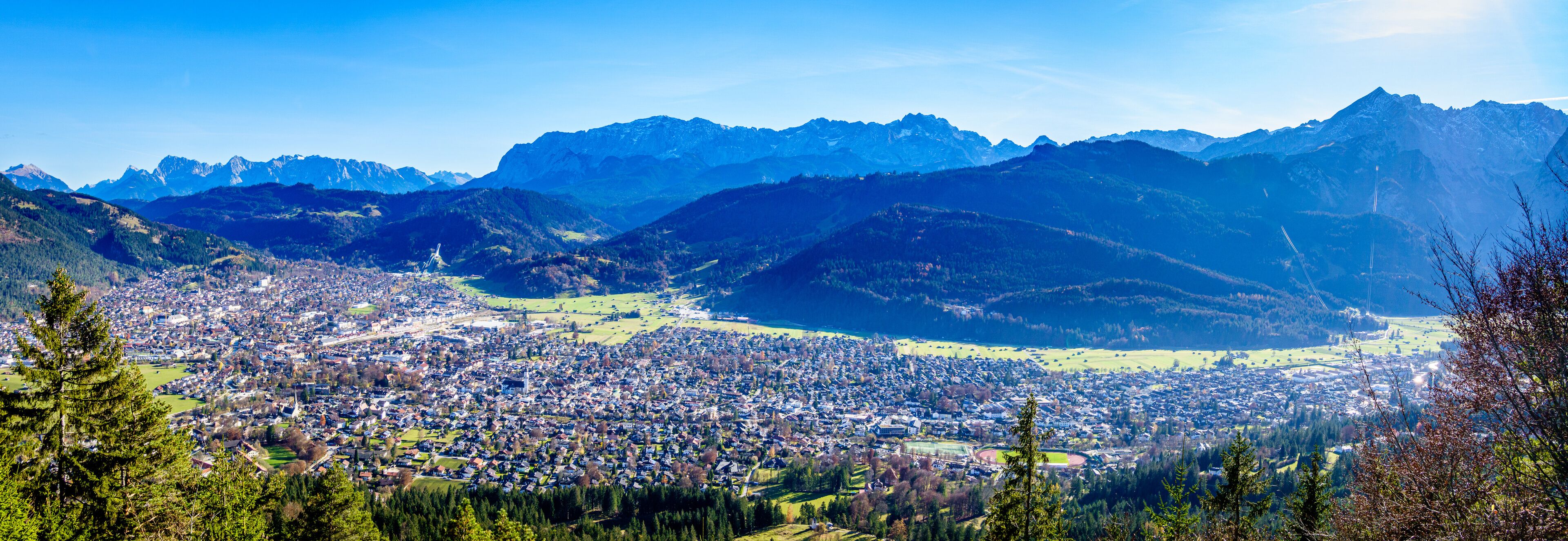 A mountainous landscape with a town nestled in a valley.