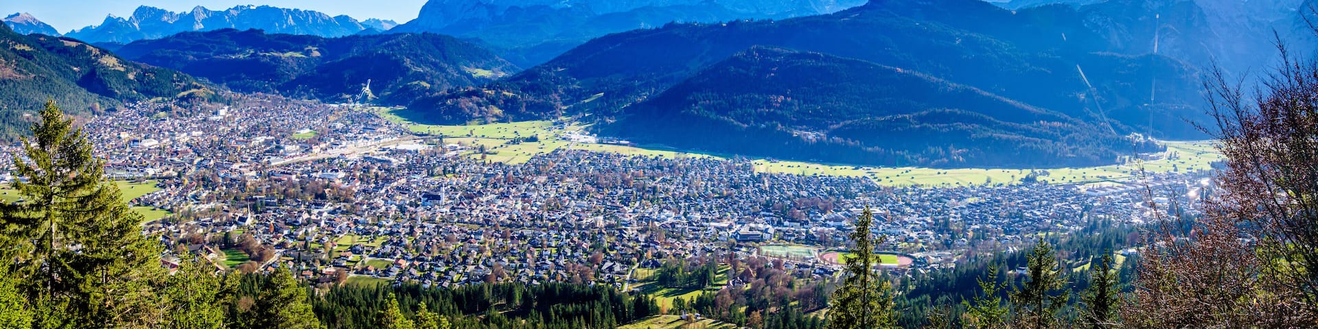 A mountainous landscape with a town nestled in a valley.
