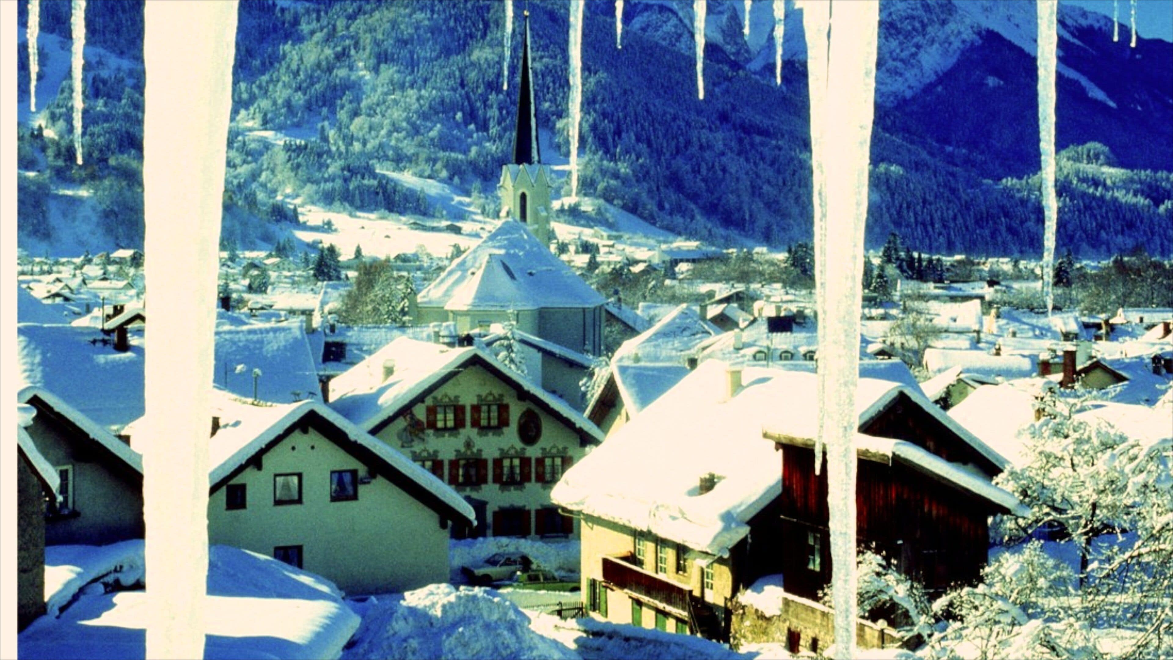 Garmisch-Partenkirchen featuring mountains, snow and a small town or village