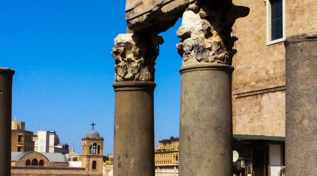 Martyrs' Square is a central, and biggest, town square in Beirut and its central district. The square took its name in 1931 to commemorate the martyrs executed there under Ottoman rule. During the Lebanese Civil War, it formed the demarcation line that divided the city in half. During the reconstruction of the Square following the Civil Ware (1975-1990) archaeologists uncovered the ruins of a Roman city with a large section of a main Roman street, with paving and columns. The street also contained the remains of Roman baths. The site features the remains of the brick vaults and columns that supported the floor, surrounded by terraces with many benches.
