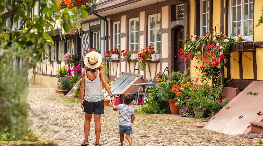 Mother and son in the medieval village in the old town of Gengenbach in the Black Forest, Germany, family vacation concept