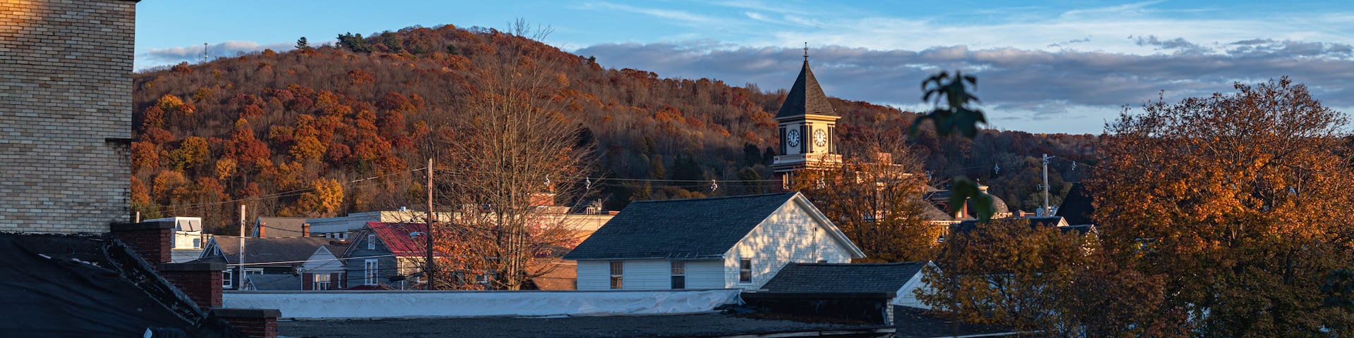 Panorama fall season of American town Bradford PA setting sun natural authentic background image