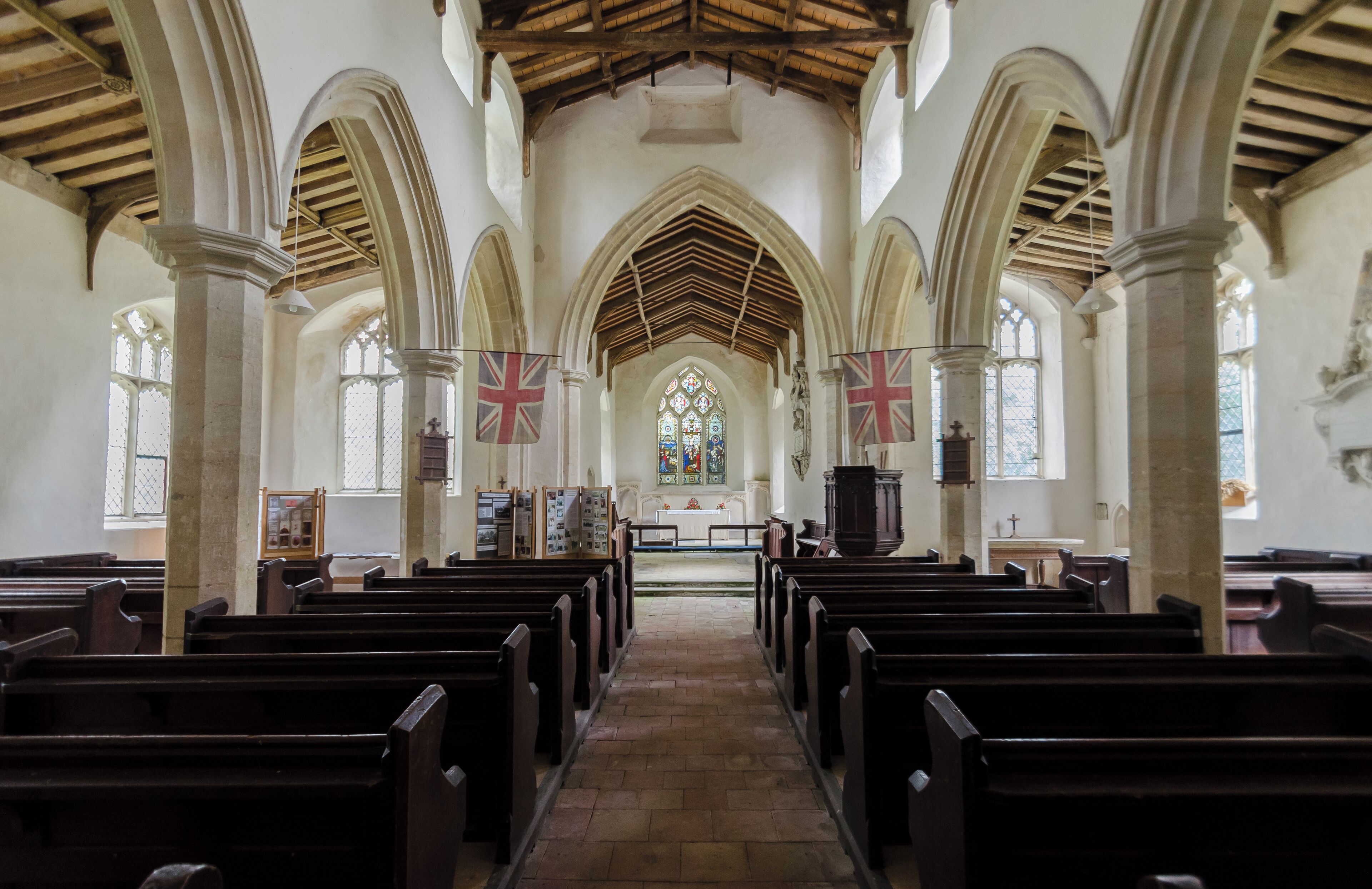 The church dates from the 14th century onwards, and consists of a west tower, nave with north and south aisles and clerestories, chancel, and north porch. Like many churches in the area it is built in flint with some ashlar and brick with lead roofs. The tower is 15th century with large buttresses and the nave aisles flanking it. There is a later brick embattled parapet. The north porch is of two storeys dating from the 15th century with a stair turret to the west. The nave has arcades of four bays with octagonal piers. The roof line from the 14th century is still visible on the tower. The roof was originally thatched. There were originally box pews in the nave and these were replaced along with a new pulpit in 1853. The chancel has a piscina and a three light east window with early Victorian stained glass. There are several good wall monuments. The church was declared redundant in the late 1980s and was accepted by the Churches Conservation Trust in 1995 who carried out restoration work.