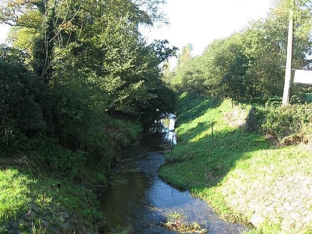 A Mysterious Stream The stream in the photograph runs past the grounds of Broom Hall Country Hotel and under the B1077 but appears to have no name.