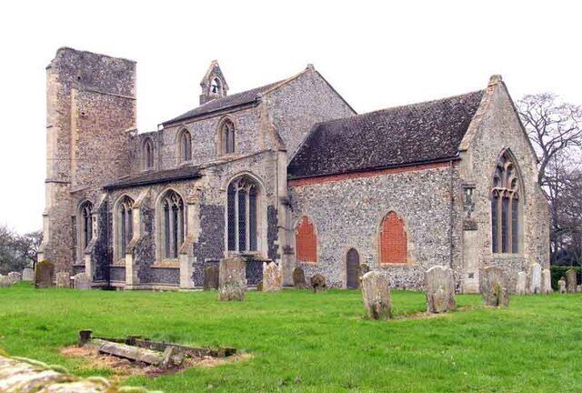 A historic stone church with arched windows and a bell tower.