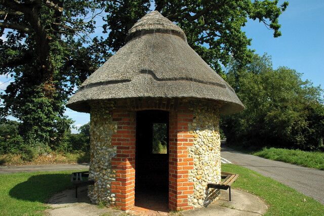Thatched shelter on the village green at Merton, Norfolk, England