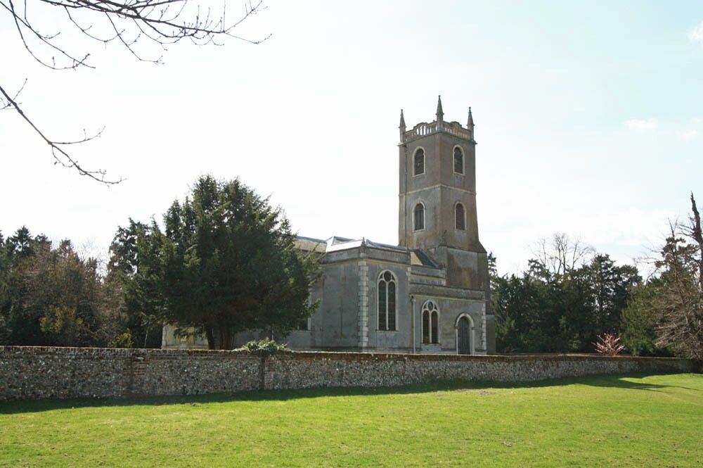 A church with a tall tower and arched windows.