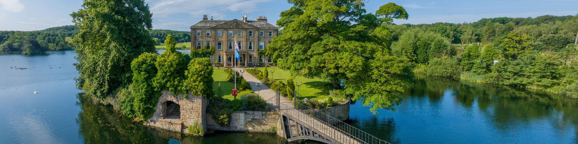 Wakefield, United kingdom. Walton Hall island and lake at Waterton Park in Wakefield West Yorkshire. Aerial view of the hall and island in the summer