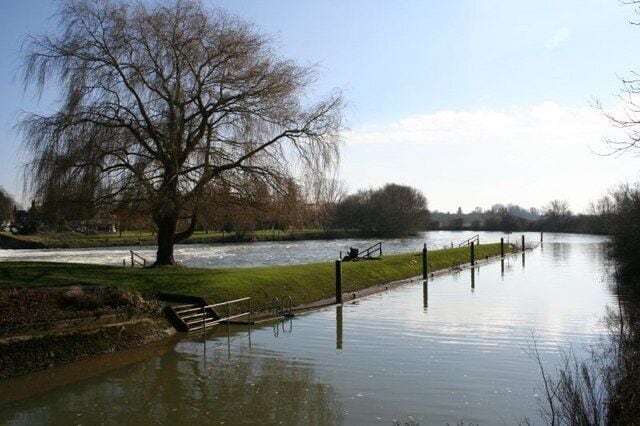 Fishing in the weir pool Solitary fisherman on the side of the weir at Benson hoping to catch the big one.