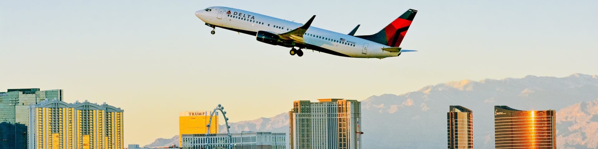 Las Vegas, NV which includes a sunset, aircraft and a city