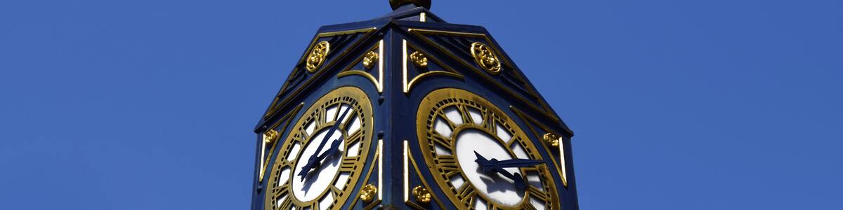 Big clock in Walsall on sunny day . Big clock on the blue sky in United Kingdom