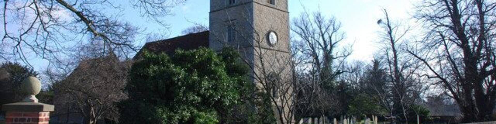 A church with a tall steeple and a clock tower.