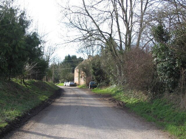 Approaching Knook village A view looking to the southwest along the lane from West Farm on the A36 on the approach to Knook village.