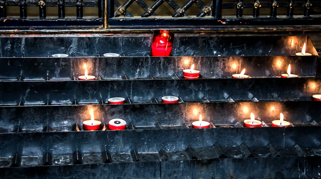 Lighted candles in a church. St Albans Cathedral, Hertfordshire, England, UK
