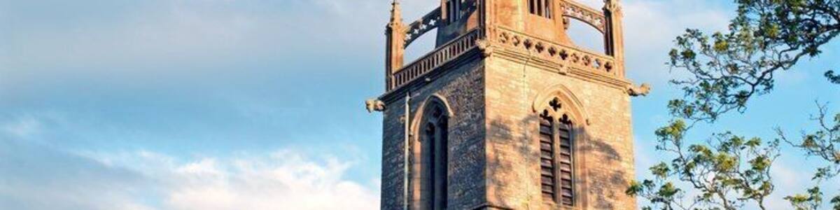 Easton Maudit Church. Sun going down mid May 2015. This church tower with its flying buttresses, the church and the surrounding village were important filming locations for the Father Brown tv episode "The Hammer of God" (1974).