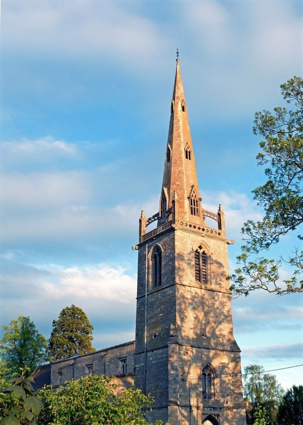 Easton Maudit Church. Sun going down mid May 2015. This church tower with its flying buttresses, the church and the surrounding village were important filming locations for the Father Brown tv episode "The Hammer of God" (1974).