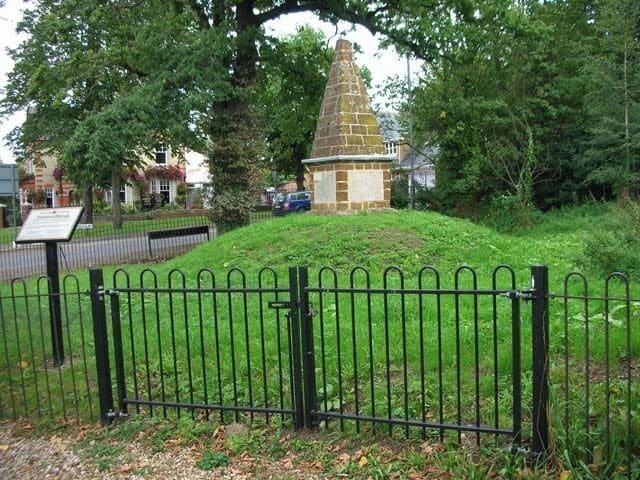 Finedon Obelisk. Erected by John English Dolben in 1789 at the cross-turnpikes (now the A6 and A510). It probably celebrated the recovery of George III from a period of insanity. The faces displayed verses to give delight, and gave distances to various destinations.
