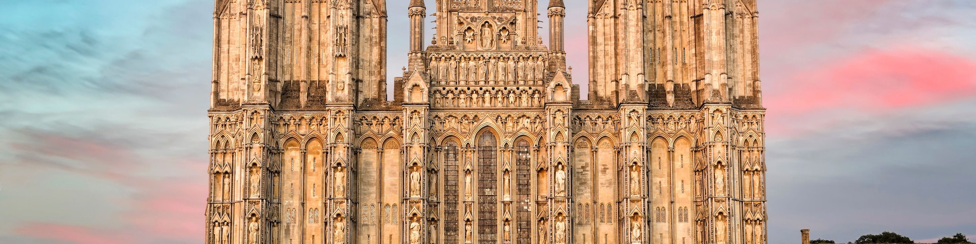 A large Gothic cathedral with twin towers and intricate stonework.
