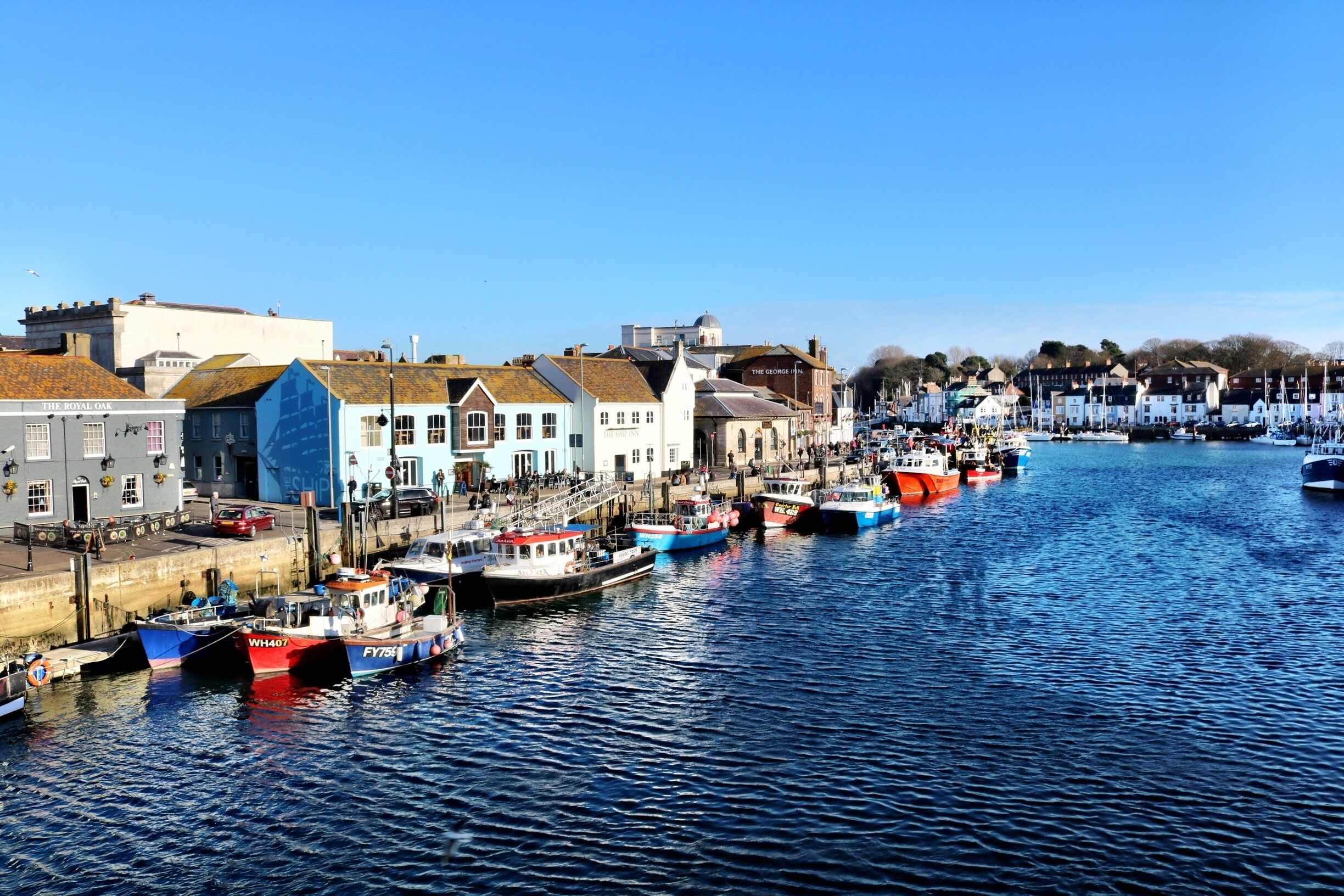 Weymouth Harbour and Marina. Sit outside the George Inn and watch the boats come and go. 