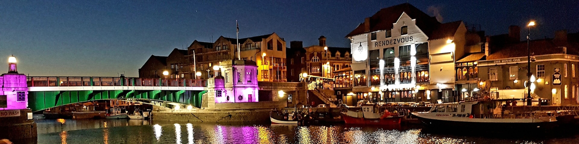 Great view on the harbour. The lights change colours. And their is a brilliant fish and chips shops right behind me from this angel of the picture.
