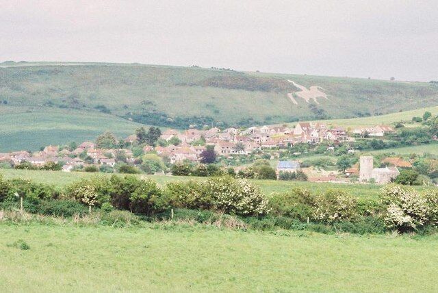 Preston and the white horse, from Jordan Hill. Looking over the village of Preston with the 447647 in the distance.