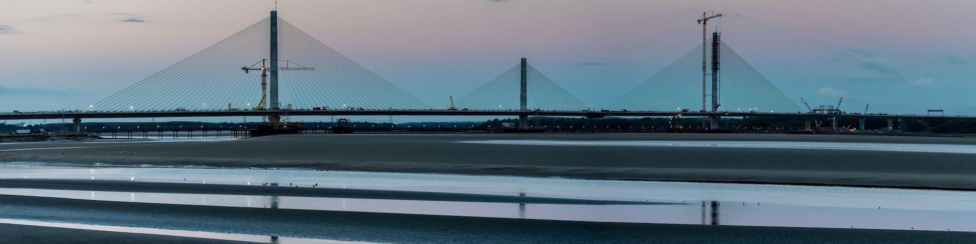 The Mersey Gateway Bridge is a toll bridge between Runcorn and Widnes in Cheshire, England, which spans the River Mersey and the Manchester Ship Canal