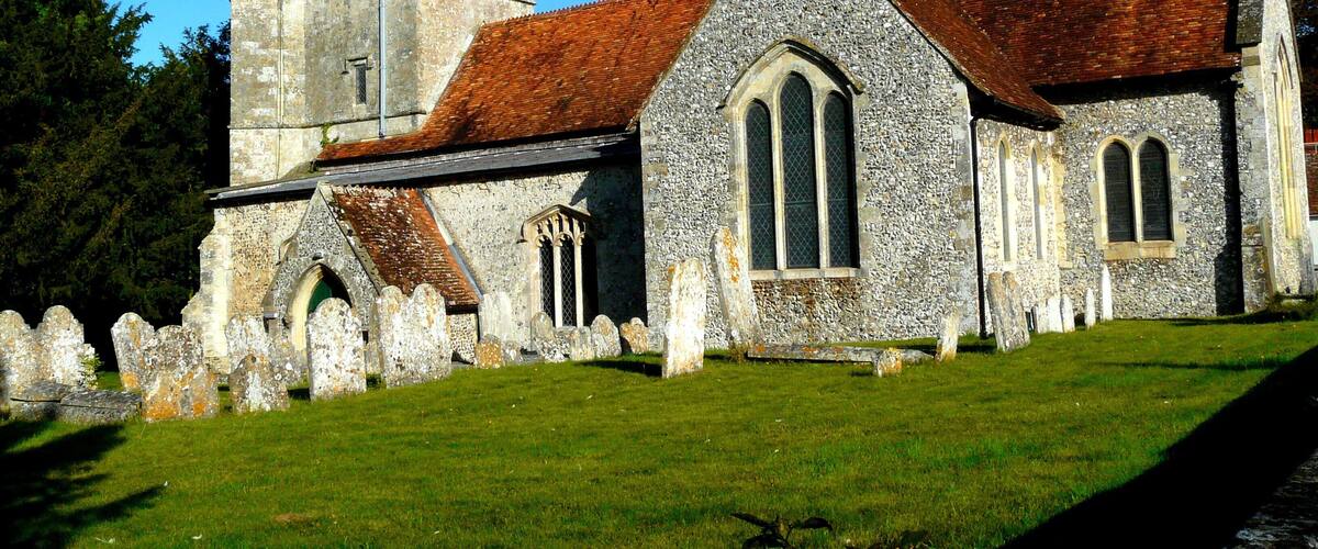 A historic church with a prominent tower and a stone facade.