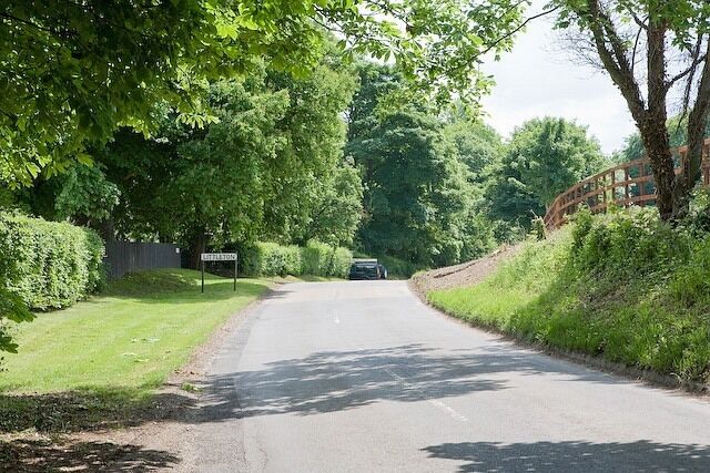 Entering Littleton on the minor road from Crawley The bank on the right had recently been cleared of scrub.
