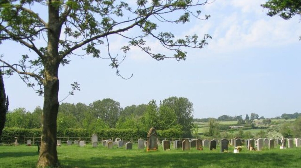 St Mary's, Micheldever, churchyard The churchyard provides a magnificent view across the Dever valley. with the railway running across the horizon in the distance.